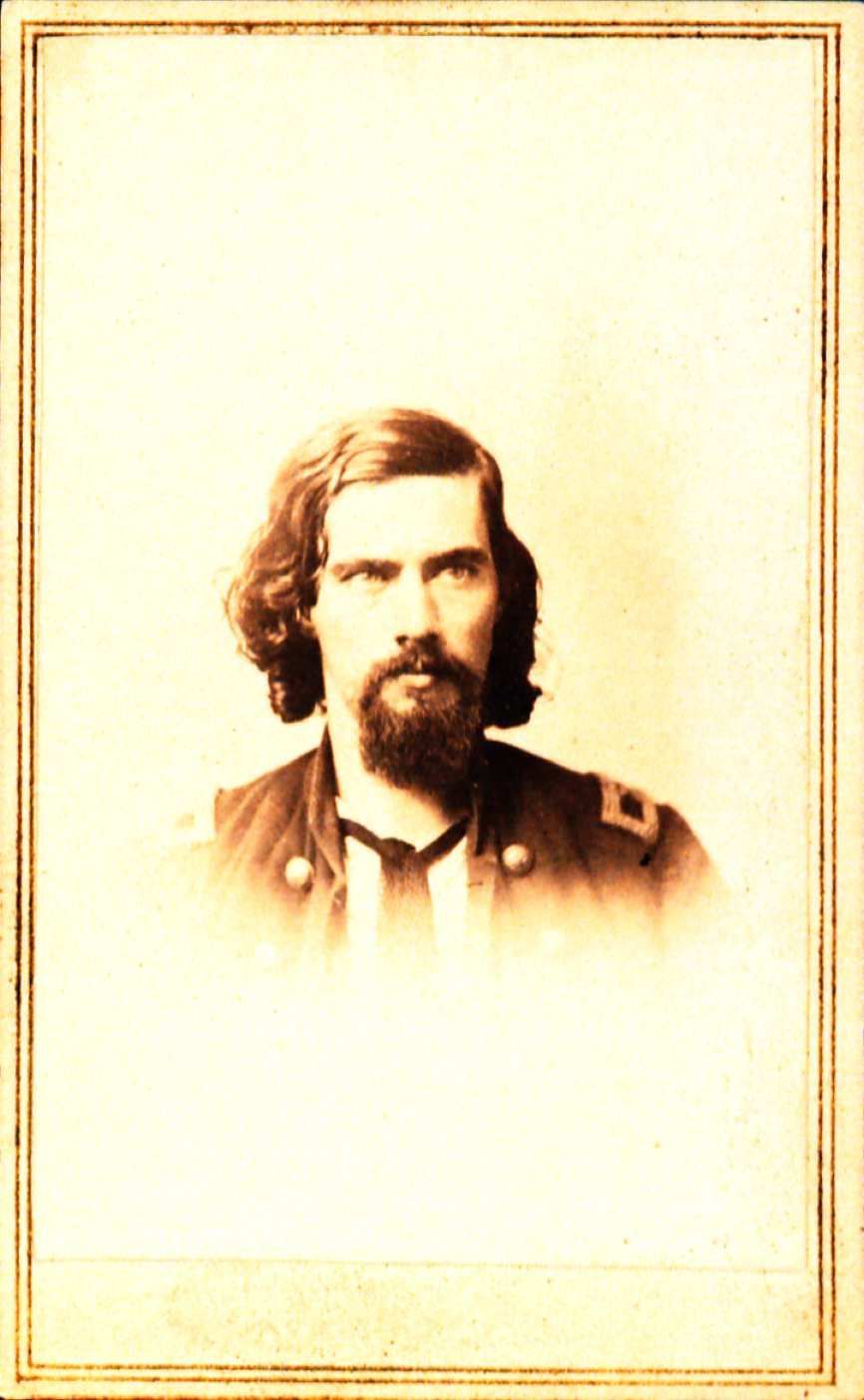 Picture of a back of a photo with a Stamp of J.T. Gray Photographer stating that the picture is of John Black