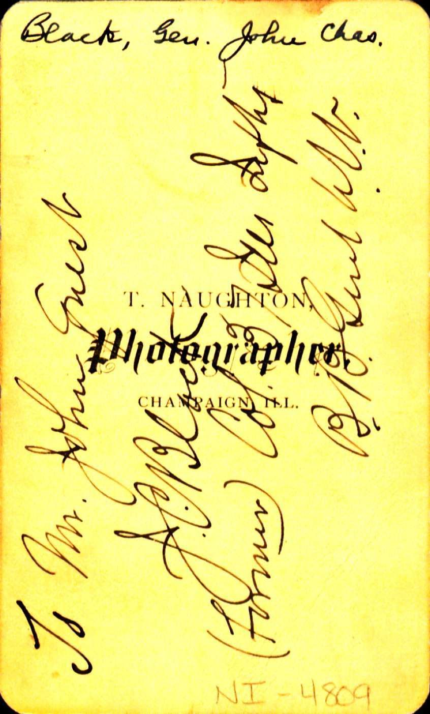 Yellow background paper with the name T. Naughton Photographer and cursive writing over the top