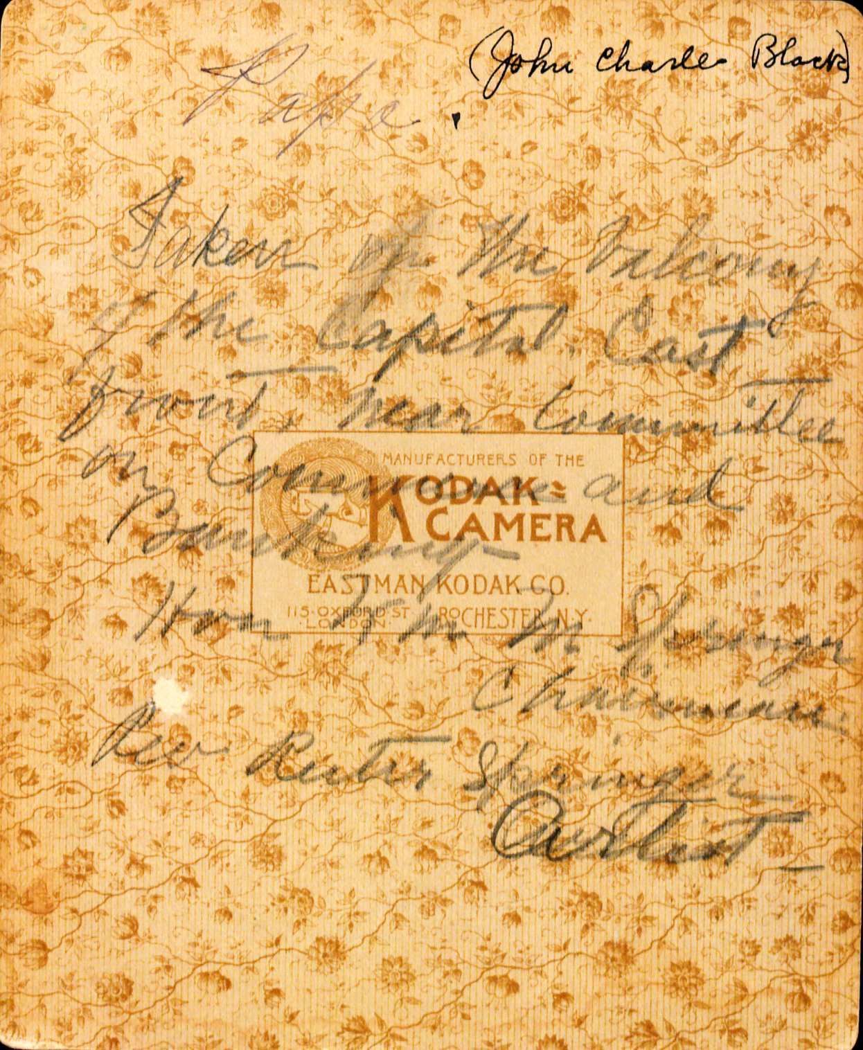 Back of a picture with cursive writing writen over the top.