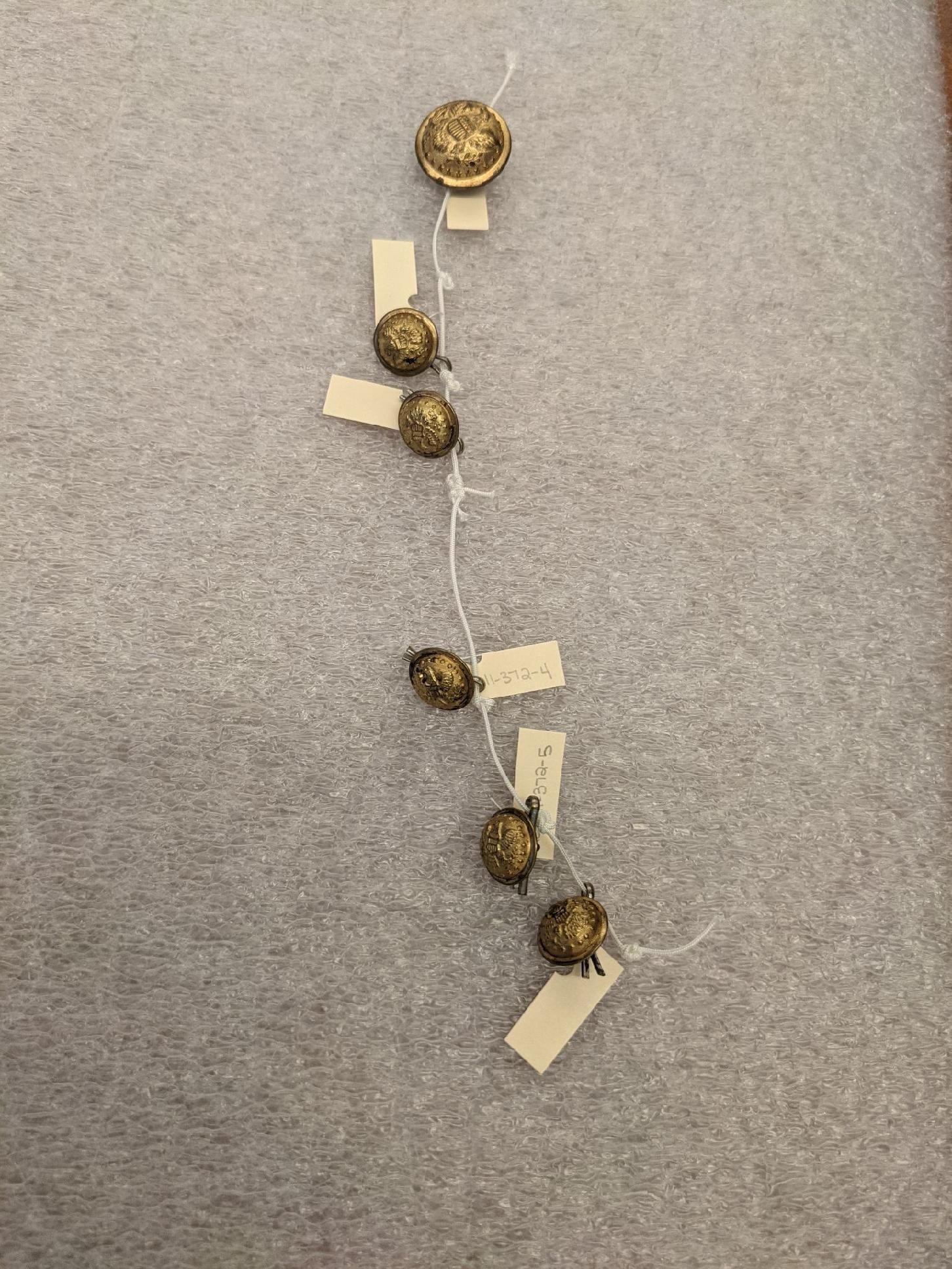 Picture of a GAR Buttons on a string