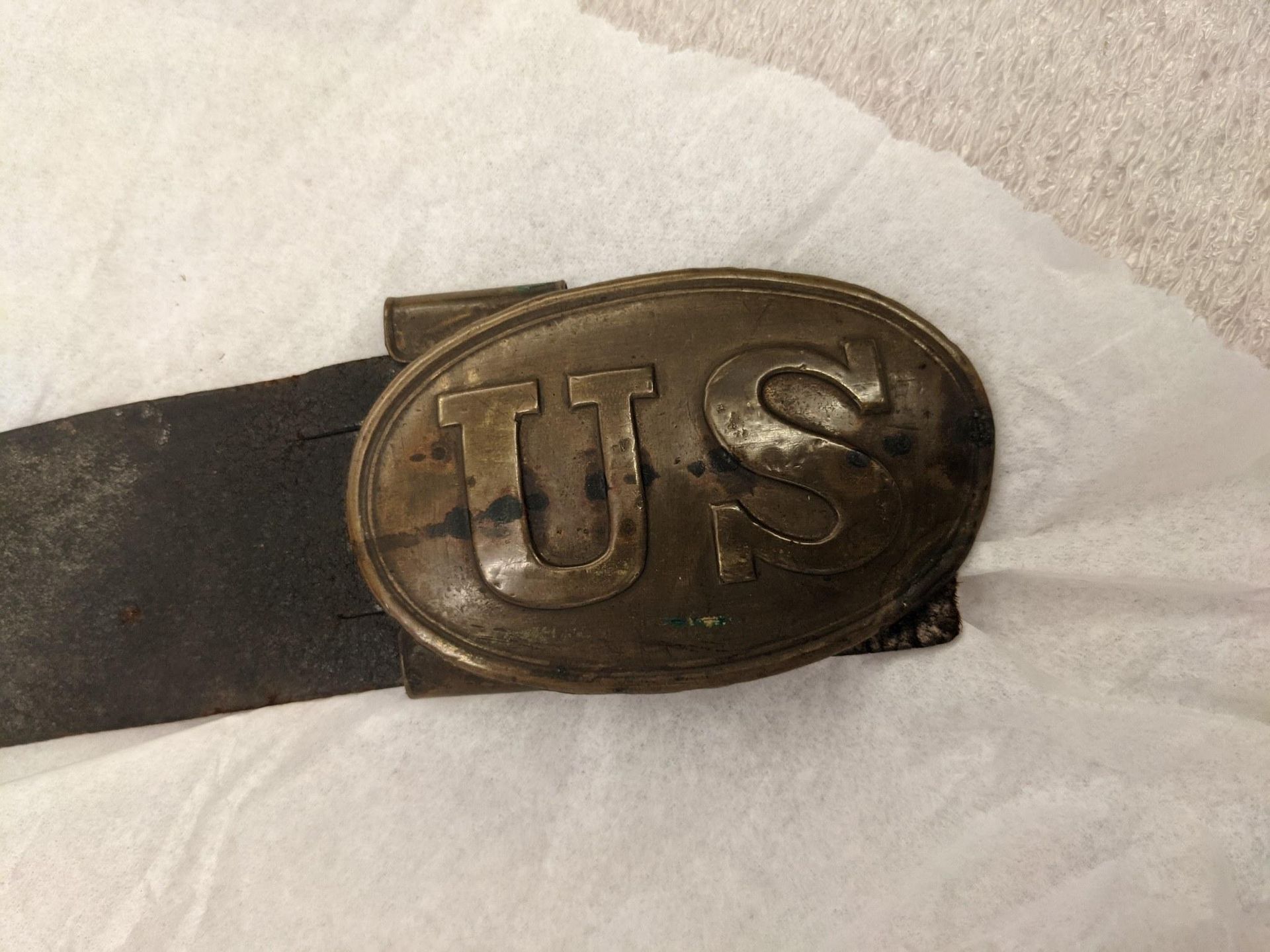 Picture of a belt buckle with the word 