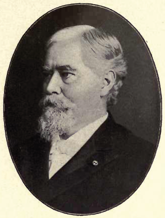 Portrait of John Black facing off to the left. He has a moustache and a beard. He is wearing a white shirt with a white bowtie and a black suit jacket