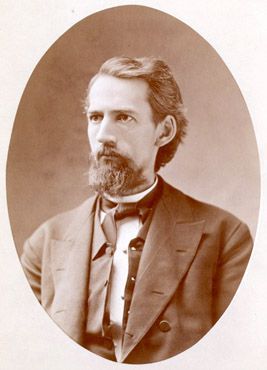 Portrait of William Black. He is looking off to the left. and is wearing a suit with a vest and a dark colored cravat