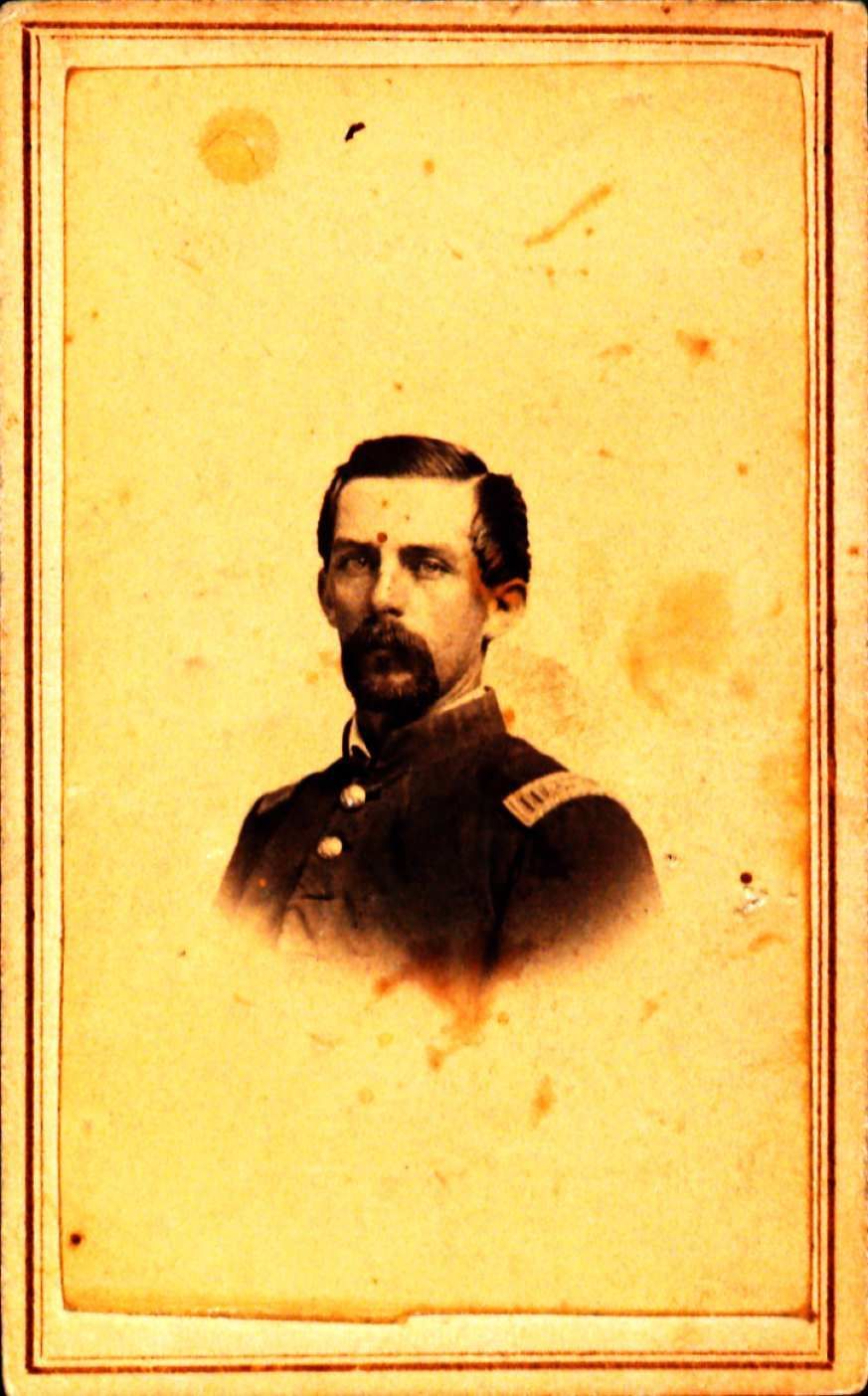 Portrait of William Black. He has dark hair, a dark colored moustache and a beard. He is wearing a military uniform.